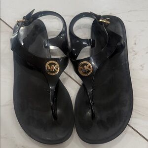 Michael Kors Black Thong Sandals with Gold Emblem